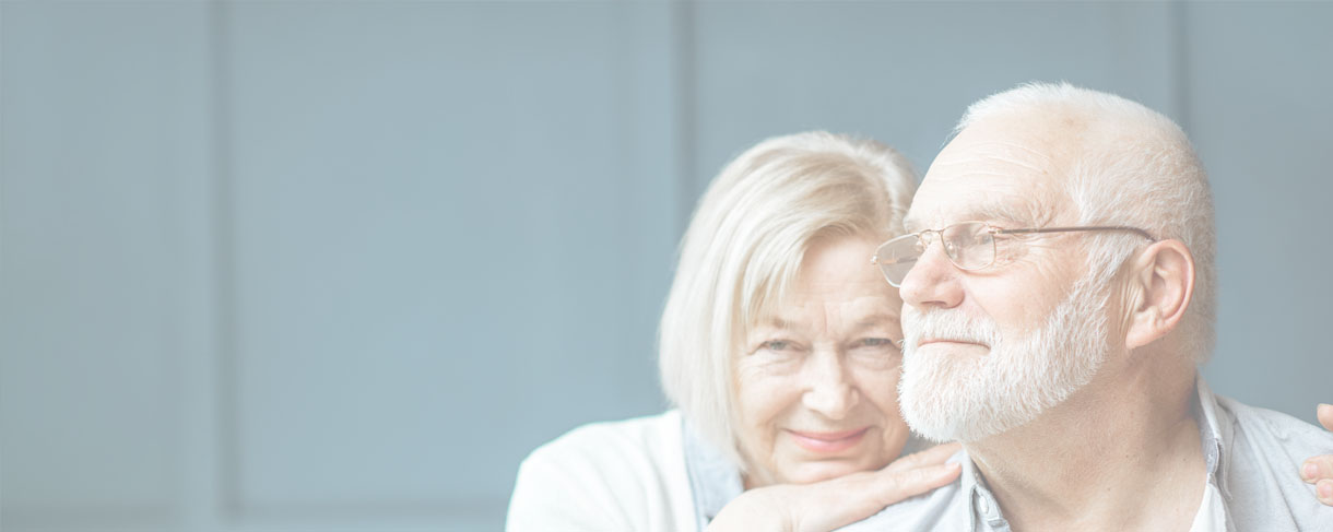 Portrait of happy family sitting on floor
